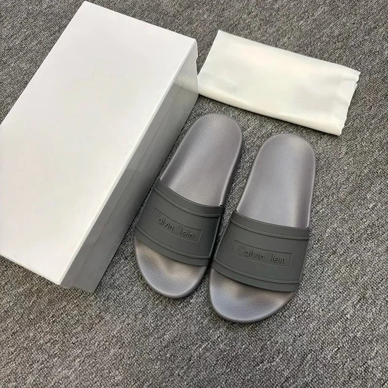 Calvin Klein Slippers Geometric cutout slide — CK-gray letters