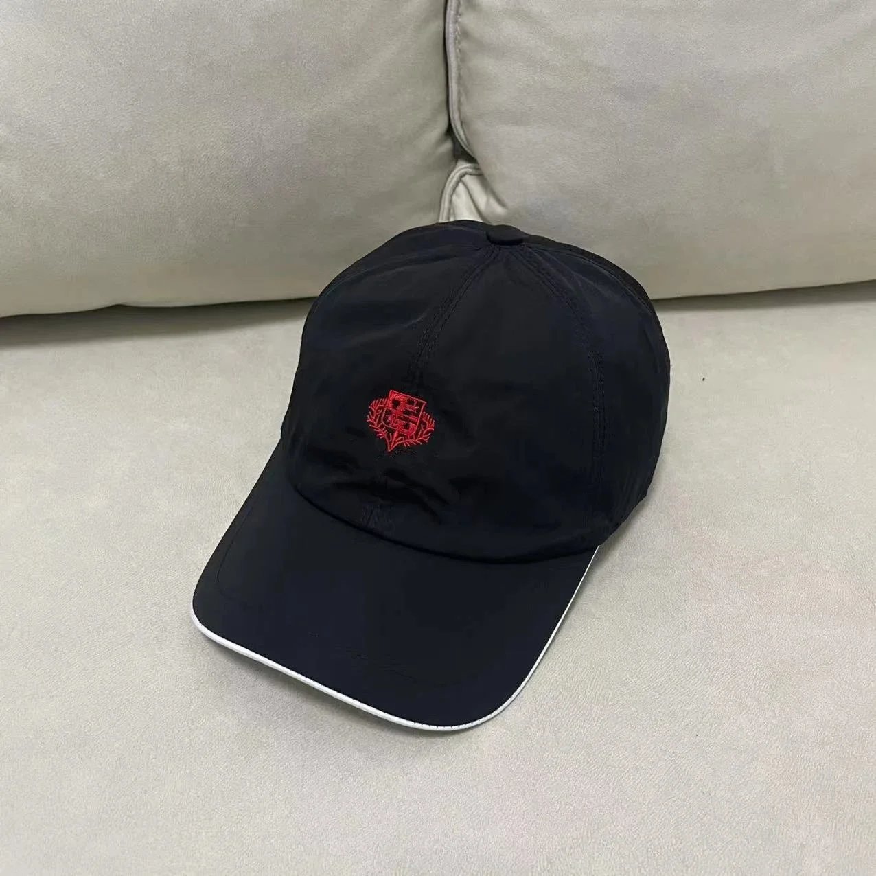 Brunello Cucinelli Hats Embroidered Crest Baseball Cap — 18 Black and red