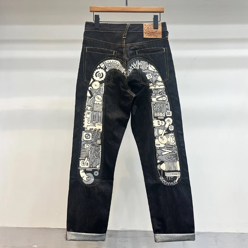 EVISU: Raw Selvedge Straight-Leg Jeans with Mechanical Gear Print and Large "M" - rep spodnie