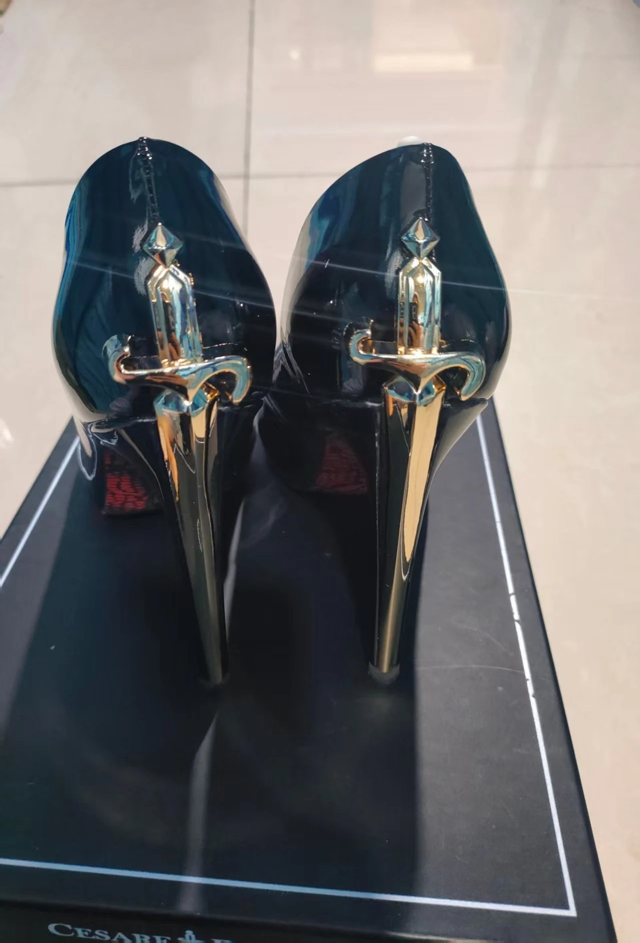 Black patent leather and golden sword