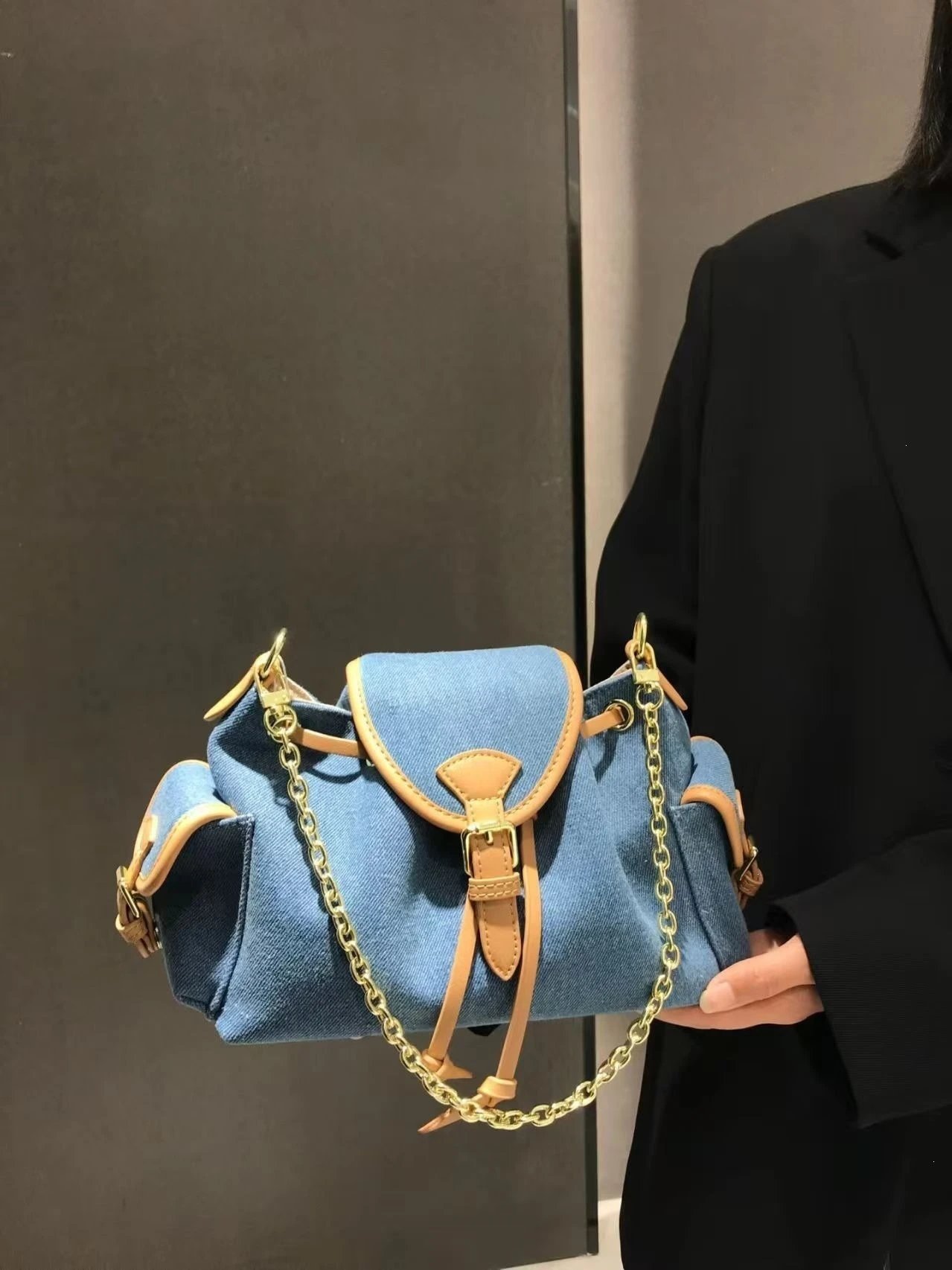 Design Denim Saddle Bag with Tan Leather Trim and Gold Chain Strap Crossbody Bags