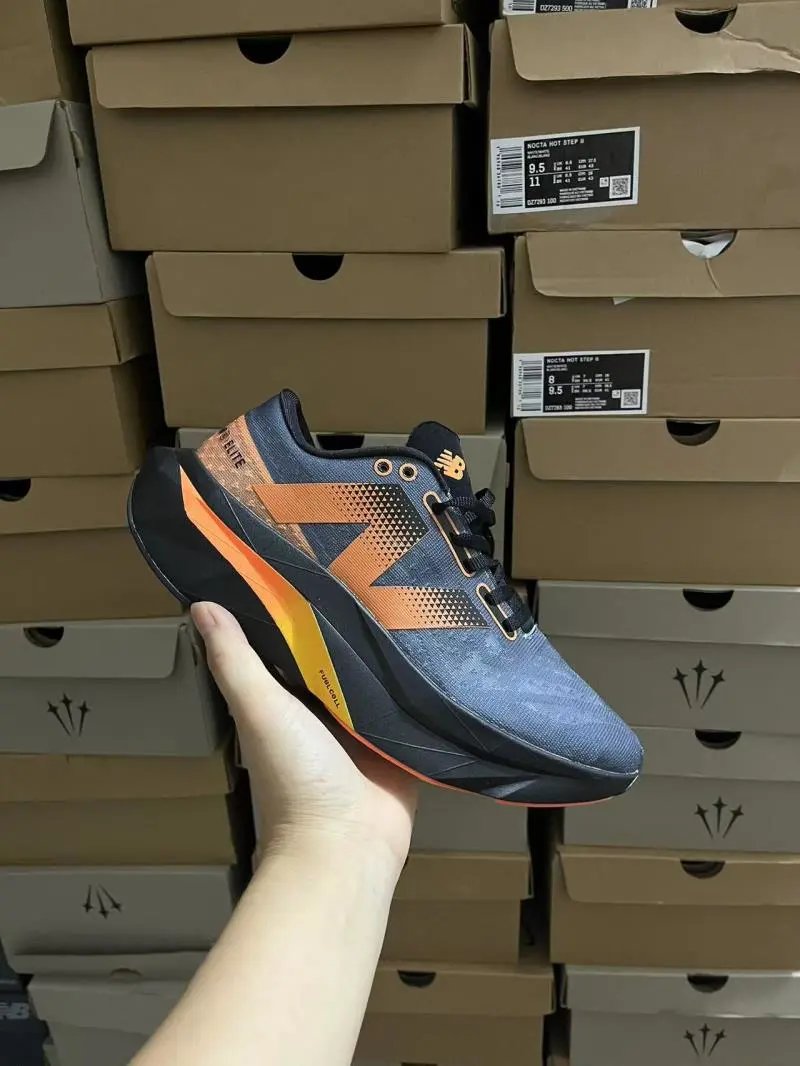 New Balance Sneakers Low-top lace-up mesh with geometric side logo and chunky midsole — Gray, black, and orange