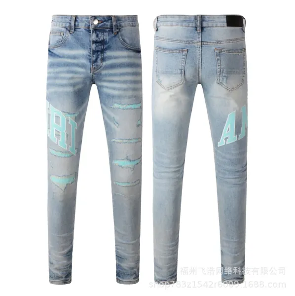 Amiri x Distressed Logo Print Light Wash Skinny Jeans - 1