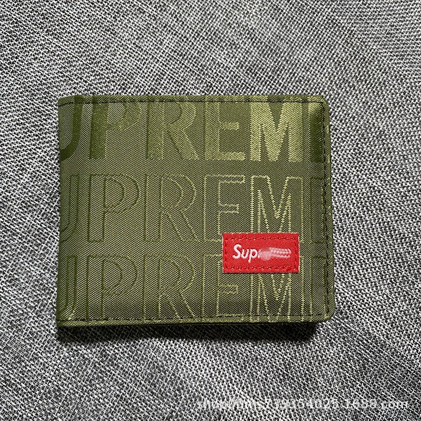 Green embroidered wallet with box