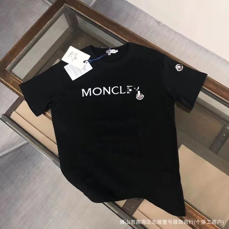 Moncler T-Shirts Logo-Print Crewneck T-Shirt — Under the black embroidery
