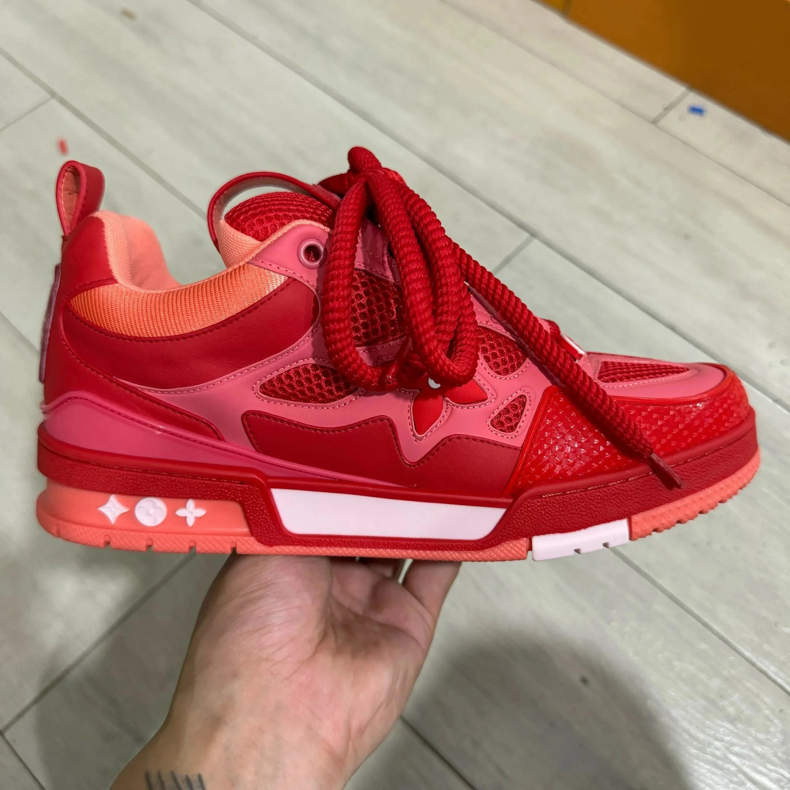 LV ice skates in red