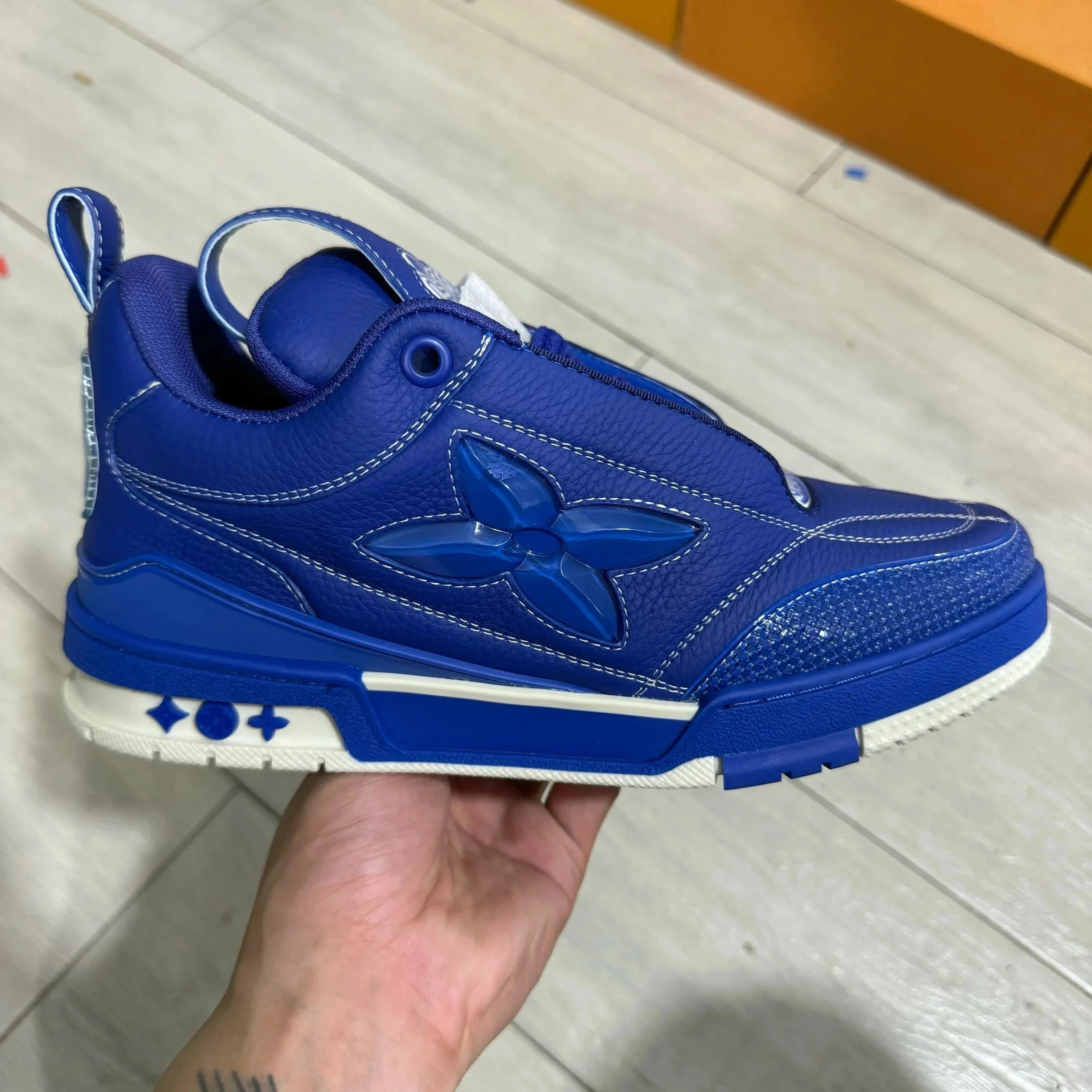 LV ice skates with blue leather surface