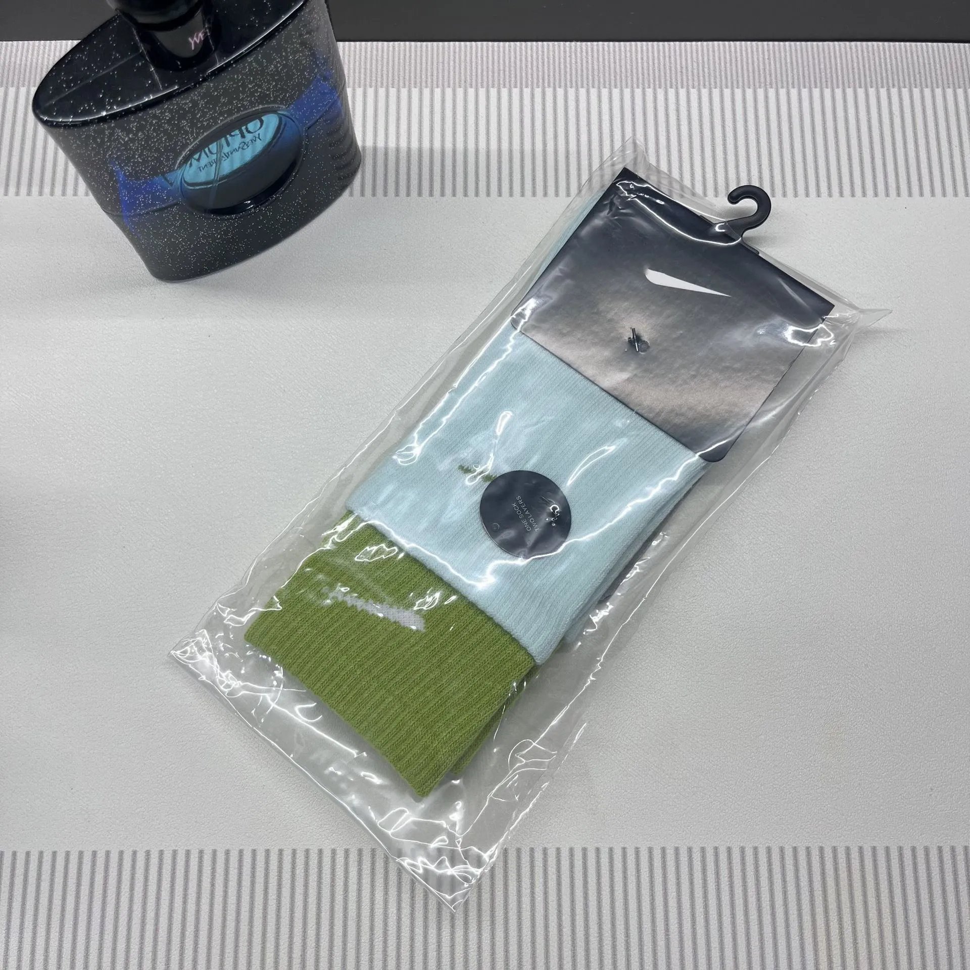 Nike Swoosh Logo Two-Tone Crew Socks Green and Ice Blue - 1