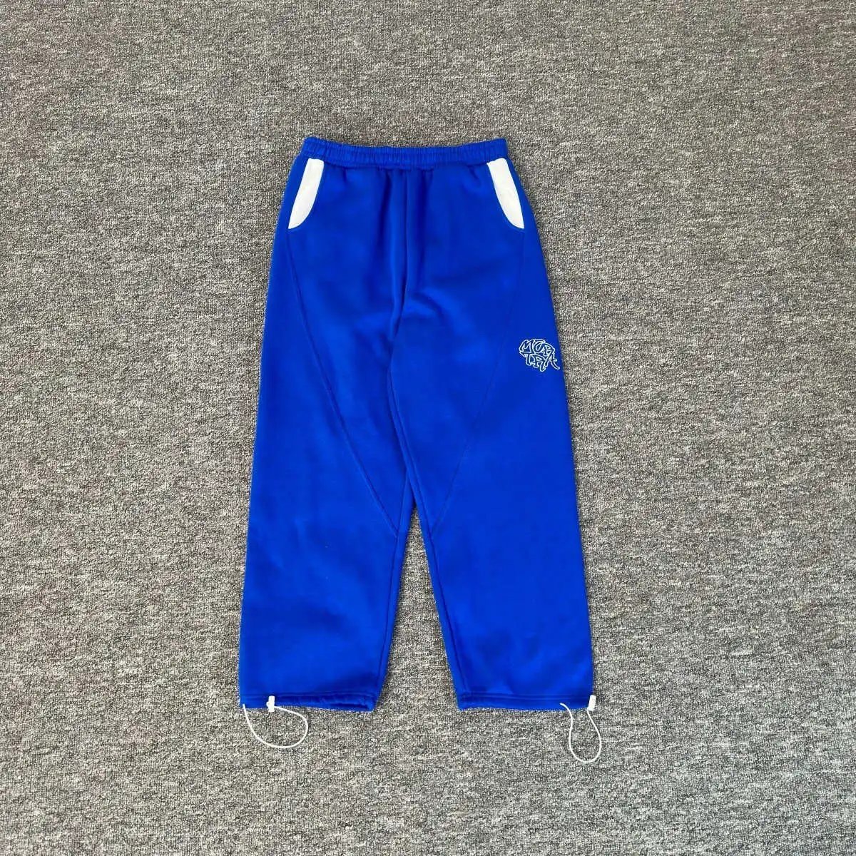 Murd33r — Klein Blue & White Color-block Casual Sweatpants with Pockets, Drawstring, and Cuffed Hems - zdjęcie produktu (rep) w bazie UsFind
