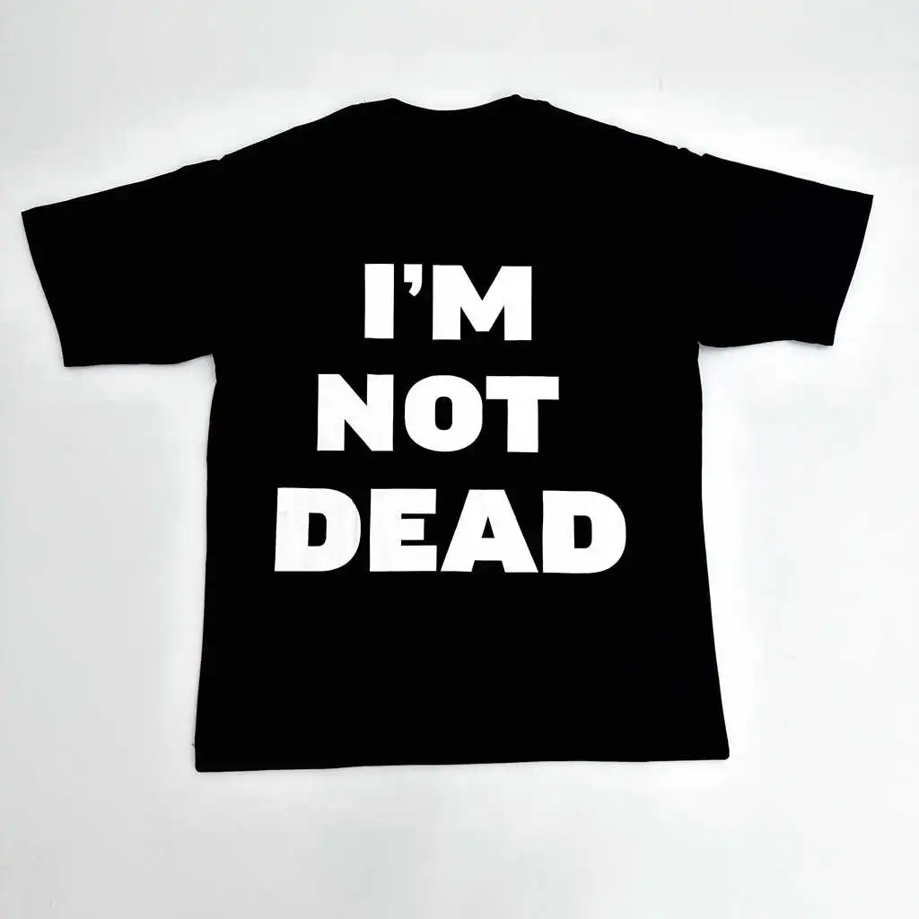 A black T-shirt emblazoned with the slogan "I’M NOT DEAD" has become a popular staple in the Dark High Street / Opium aesthetic in recent years.