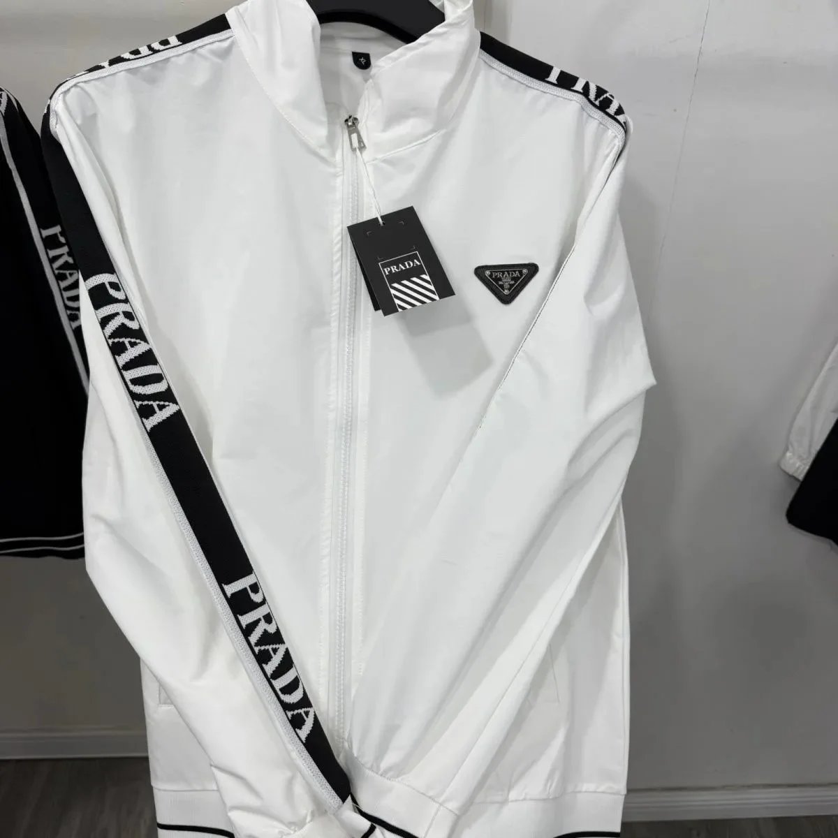 Prada Tracksuits Black zip-up hooded tracksuit with triangle logo patches — Prada20