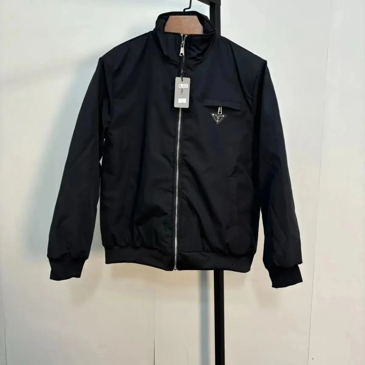 Prada Tracksuits Black zip-up hooded tracksuit with triangle logo patches — prada35