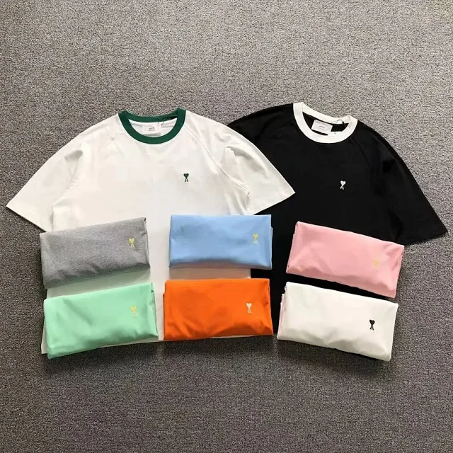 AMI Paris T-Shirts Contrast-trim crew-neck T-shirt with de Coeur chest logo product detail image 1