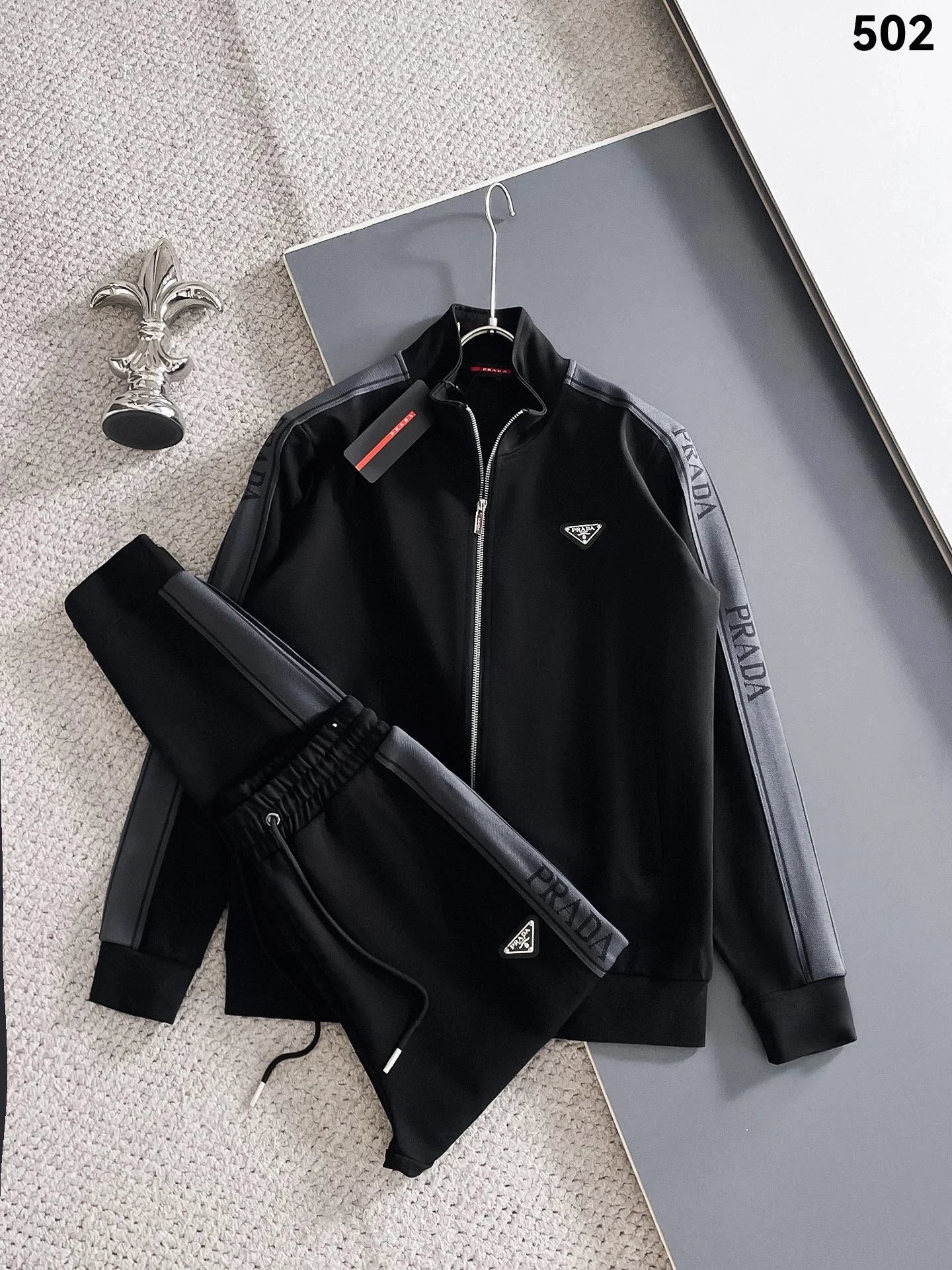 Prada Tracksuits Black zip-up hooded tracksuit with triangle logo patches — hot prada suit02