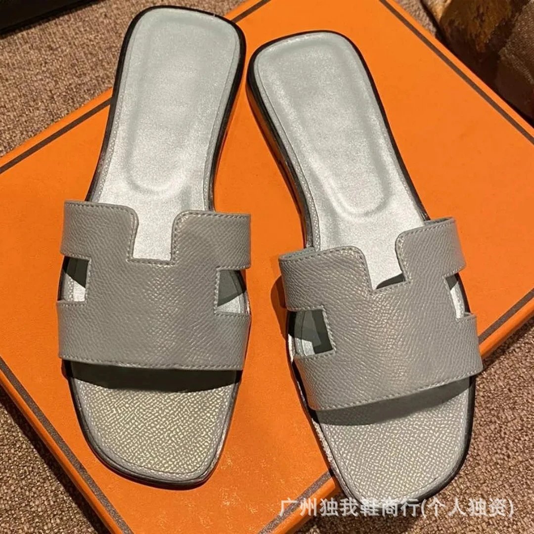 Hermès Sandals Oran H-Cut Slide — Black base, rhinoceros gray