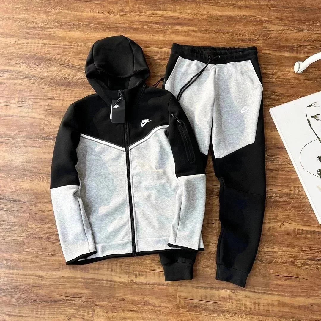 Nike Tracksuits Hooded zip-up tracksuit with jogger pants and chevron color-block panels — 11