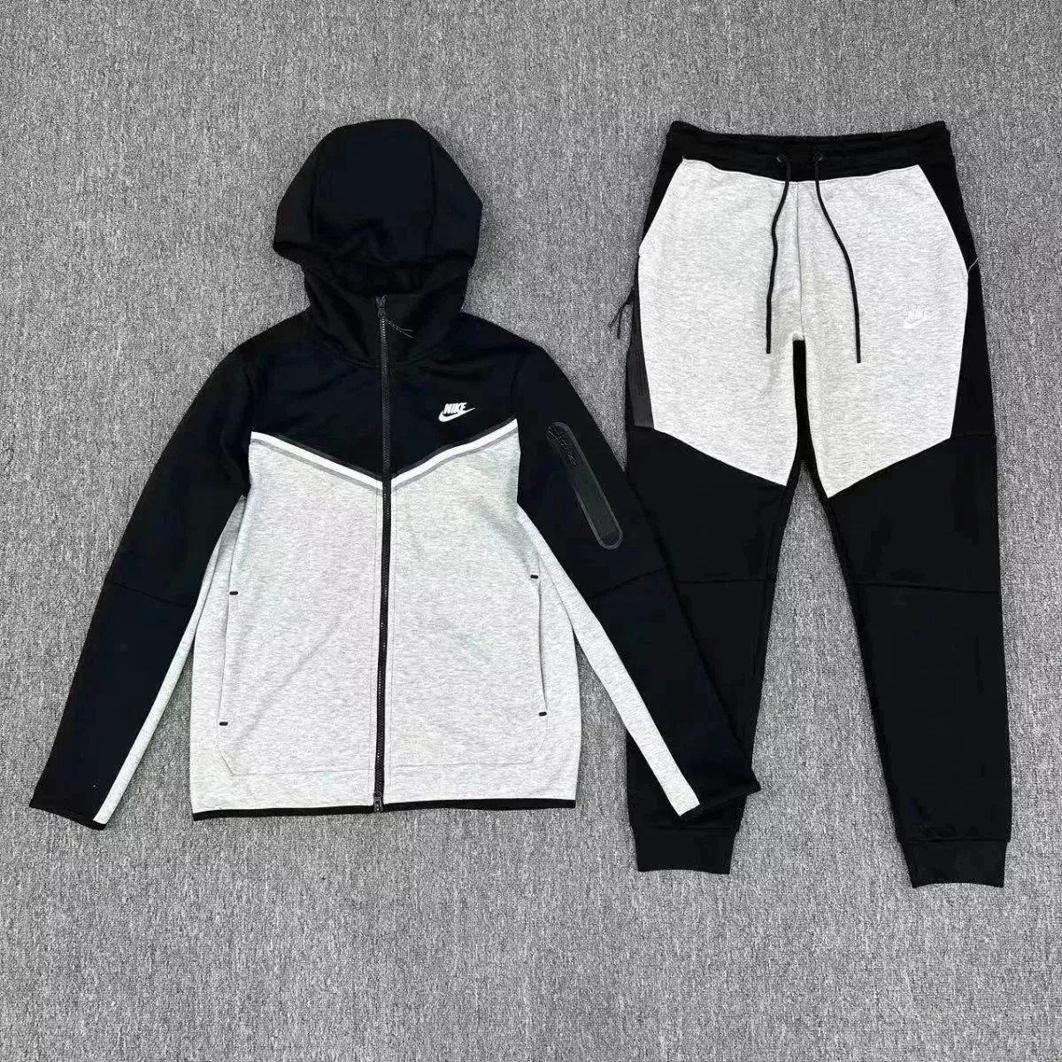 Nike Tracksuits Hooded zip-up tracksuit with jogger pants and chevron color-block panels — 18