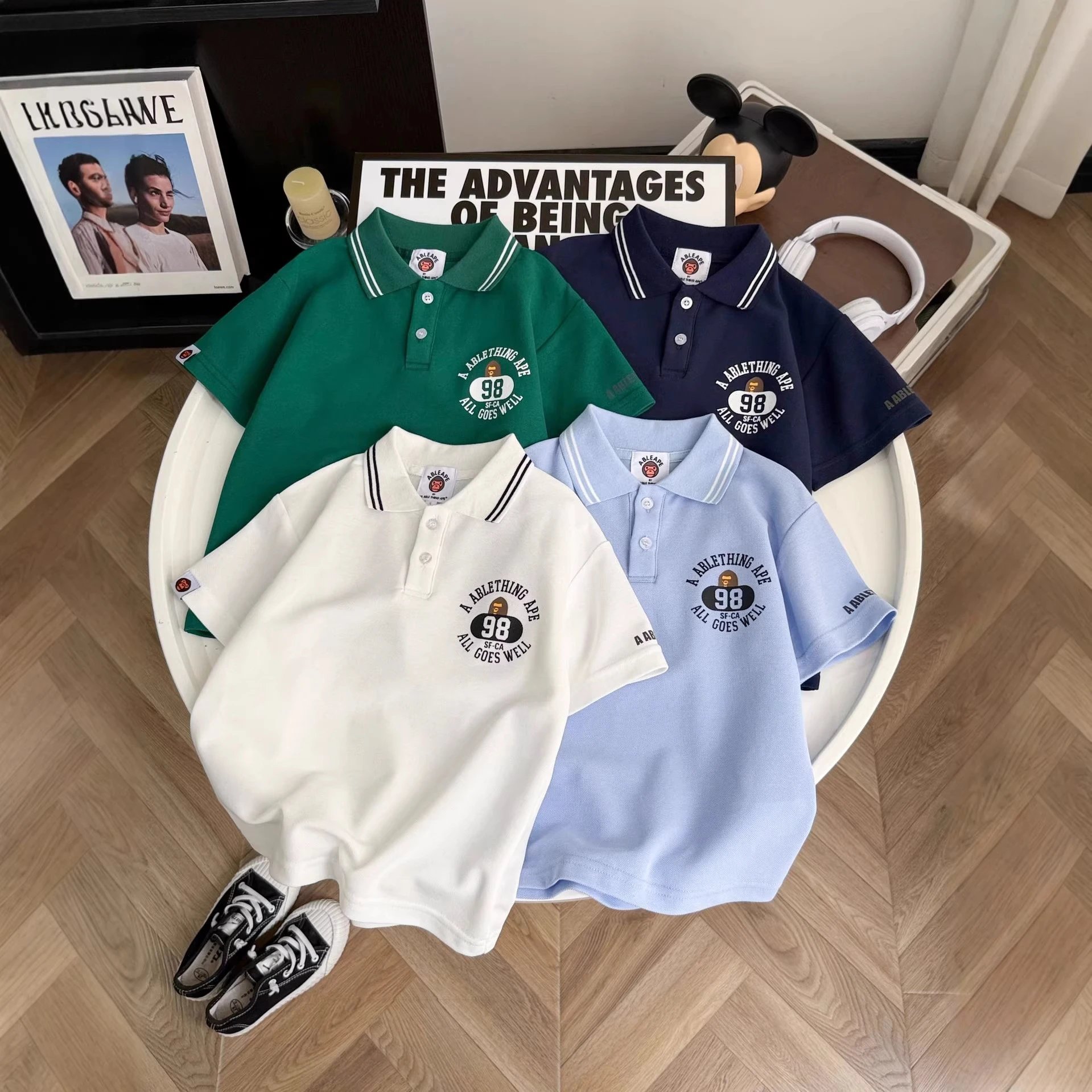Kid Ablethingape Polo Shirts in Green, Navy, White, and Blue