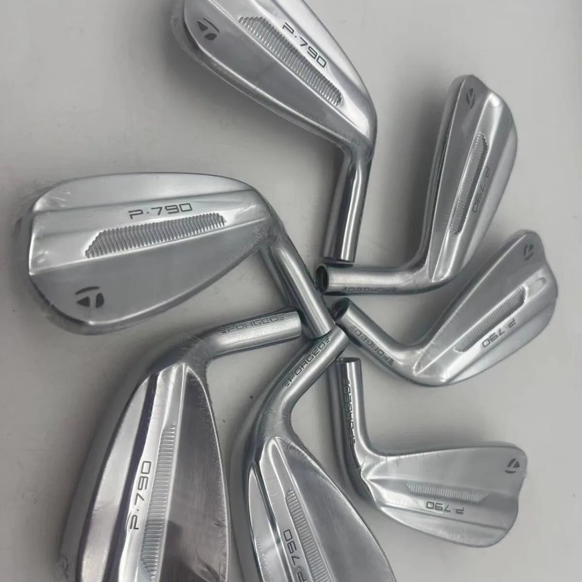 Silver club heads only, 7 pieces (shafts and grips not assembled)