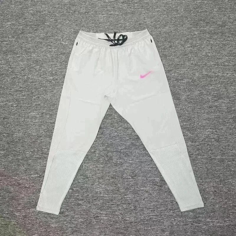 Nike Trousers Tapered running with zip pockets and reflective details — 8