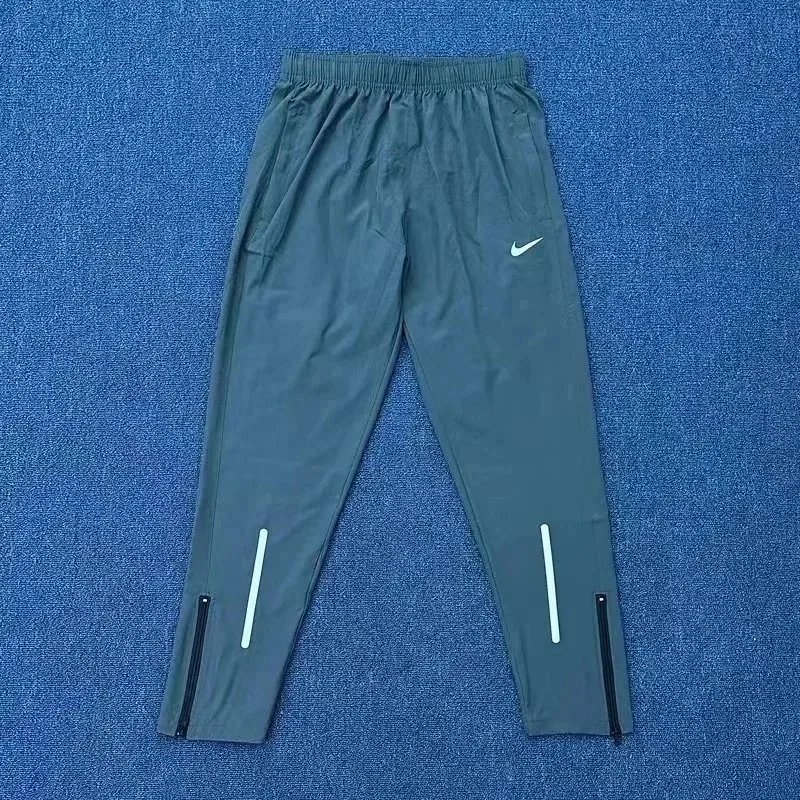 Nike Trousers Tapered running with zip pockets and reflective details — 2