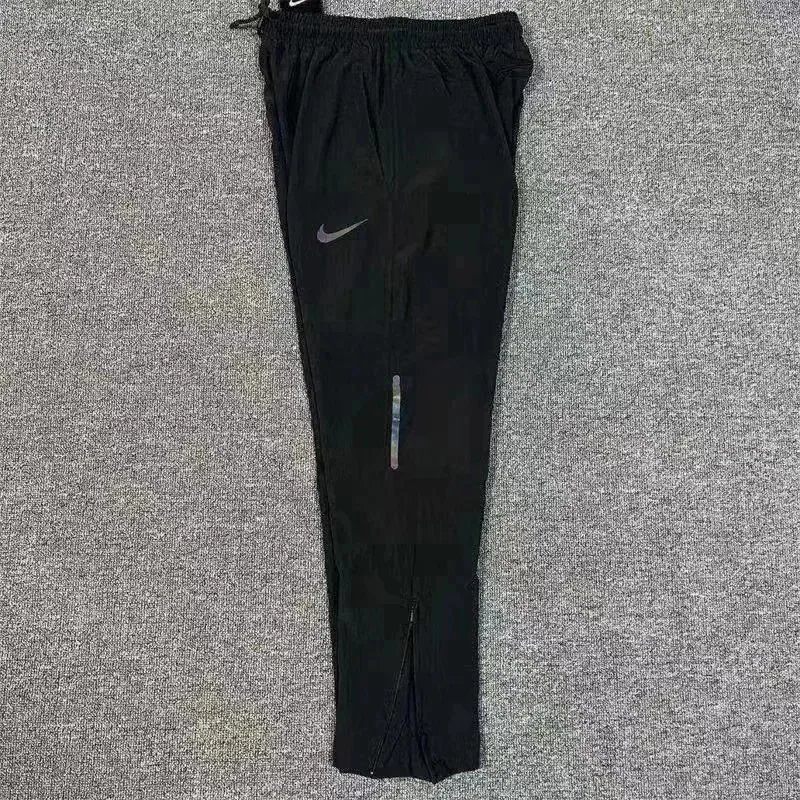 Nike Trousers Tapered running with zip pockets and reflective details — 3 Black