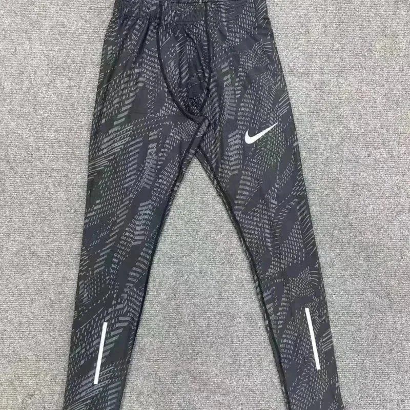 Nike Trousers Tapered running with zip pockets and reflective details — 6
