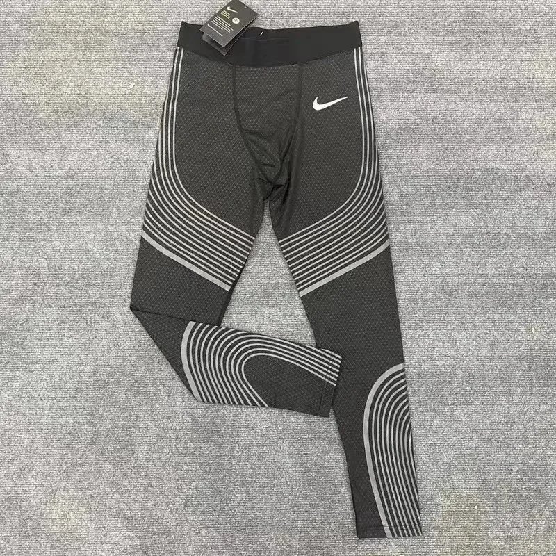Nike Trousers Tapered running with zip pockets and reflective details — 36