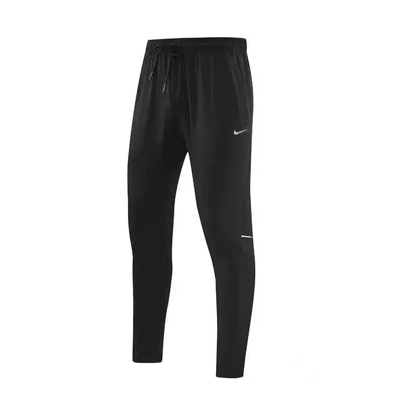 Nike Trousers Tapered running with zip pockets and reflective details — 20