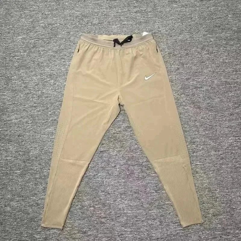 Nike Trousers Tapered running with zip pockets and reflective details — 14