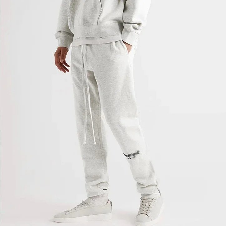 36040851919114 ESS Flocked small label bunched leg pants 1