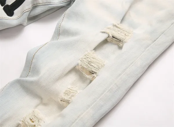 Amiri Logo Distressed Light Wash Jeans - 10