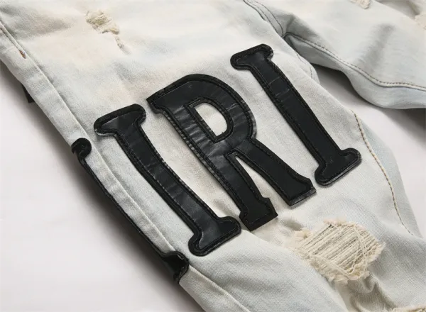 Amiri Logo Distressed Light Wash Jeans - 11