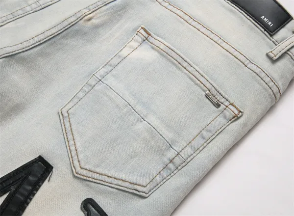 Amiri Logo Distressed Light Wash Jeans - 13