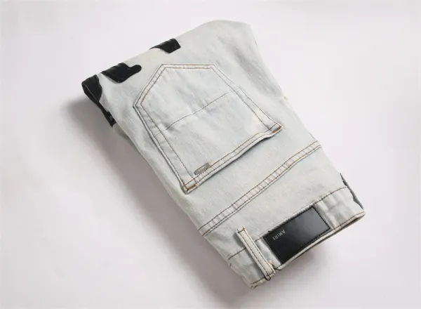 Amiri Logo Distressed Light Wash Jeans - 16