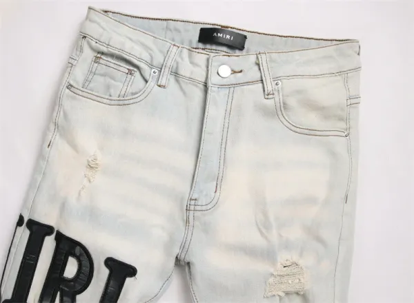 Amiri Logo Distressed Light Wash Jeans - 8