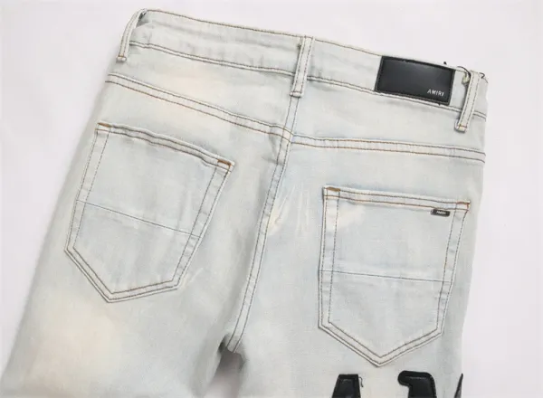 Amiri Logo Distressed Light Wash Jeans - 12