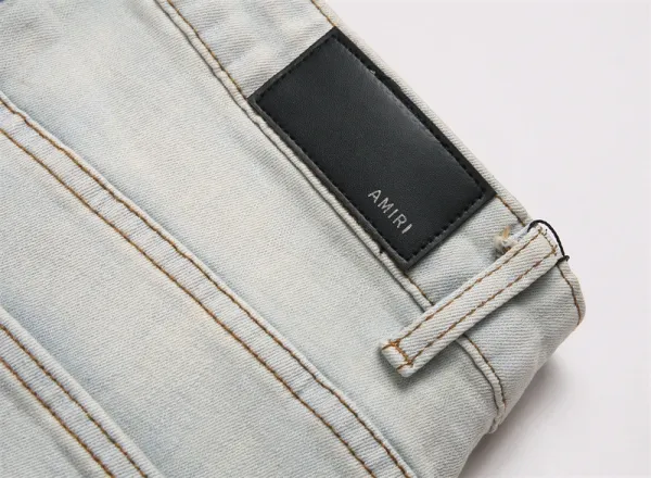 Amiri Logo Distressed Light Wash Jeans - 14