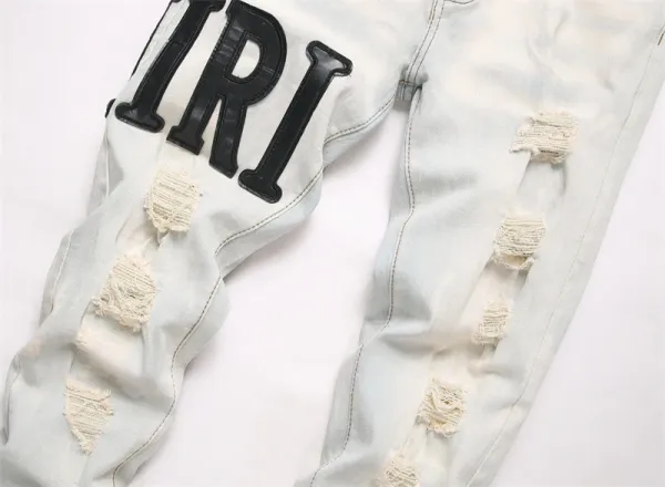 Amiri Logo Distressed Light Wash Jeans - 9
