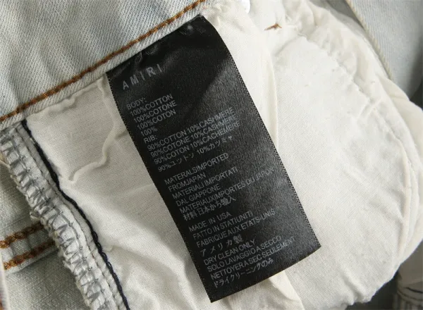 Amiri Logo Distressed Light Wash Jeans - 15
