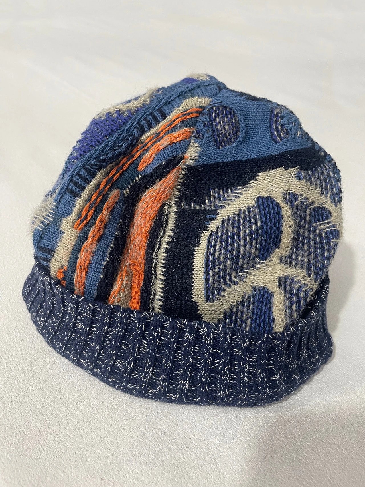 Knitted Beanie Hat with Abstract Pattern in Blue Orange and Cream - 136481