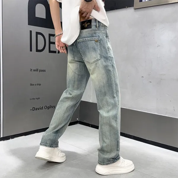 Design Wide-Leg Distressed Light Wash Jeans - 1