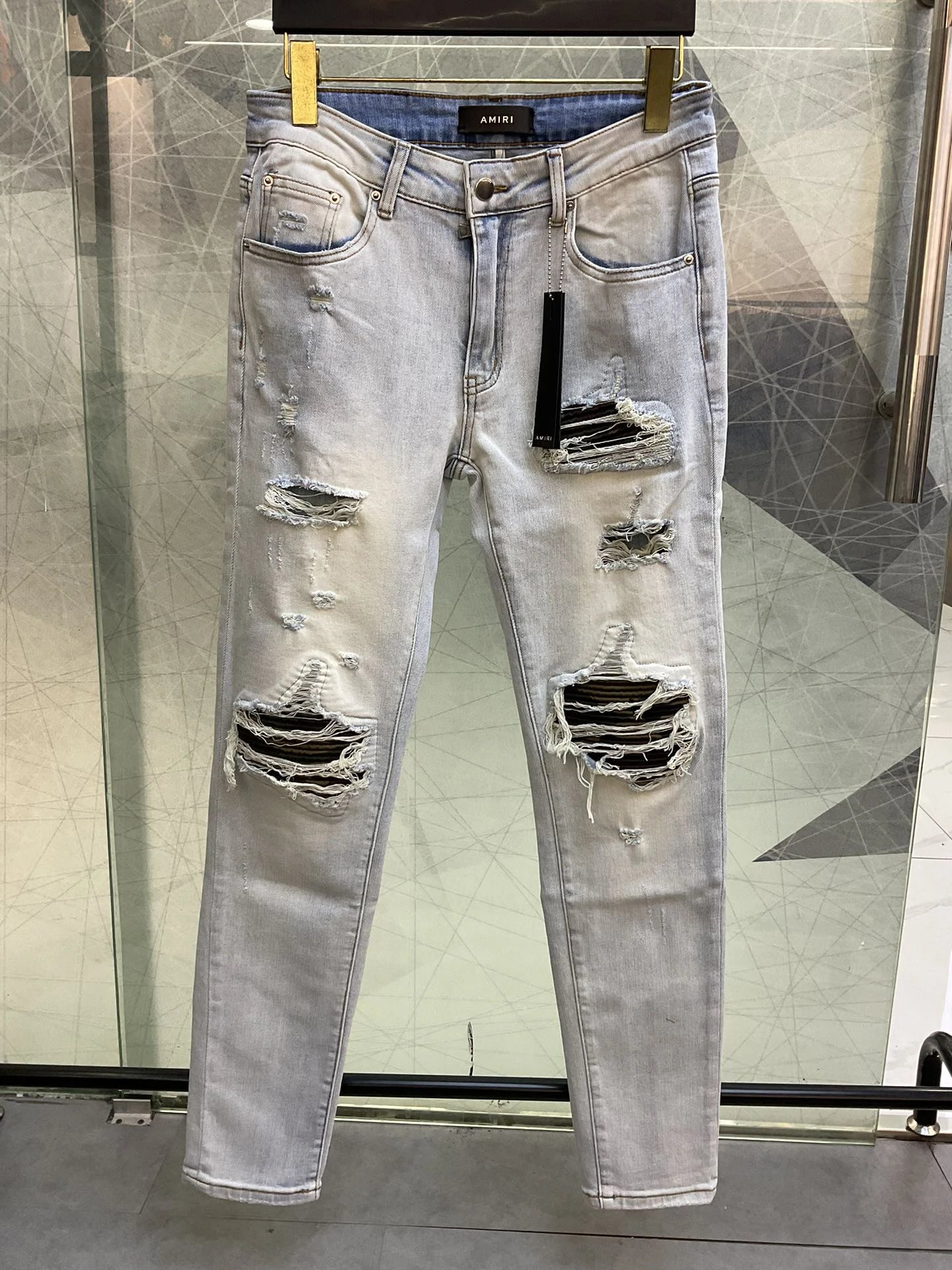 AMIRI Light Wash Distressed Ripped Slim Fit Jeans Men