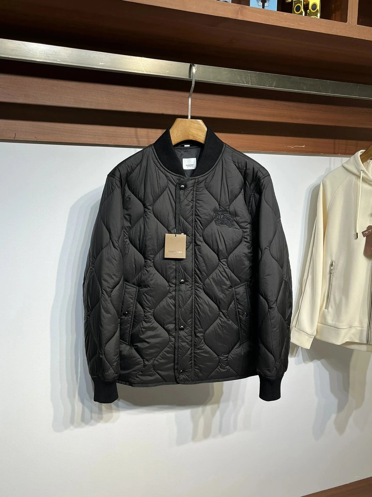 Burberry Down Jackets Quilted hooded puffer jacket — 32