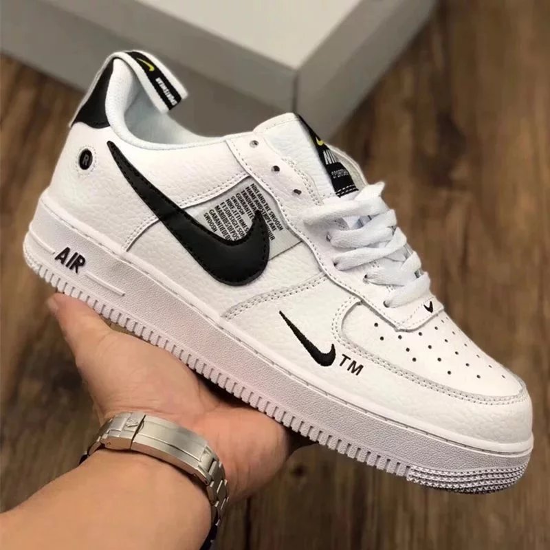 white and black low-top (shoes)