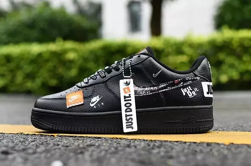 Co-branded black low-top