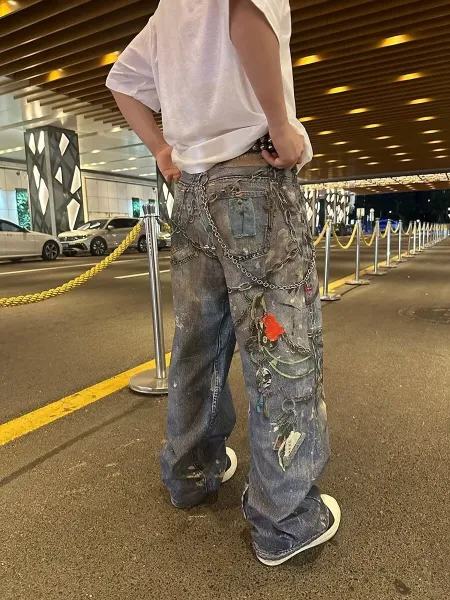 Off-White Industrial Chain-Decorated Distressed Wide-Leg Jeans - 11
