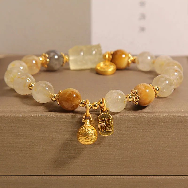 Natural blonde crystal moonstone bracelet for women who swallow gold beast titanium crystal yellow hair crystal bracelet as a gift for girlfriend and best friend
