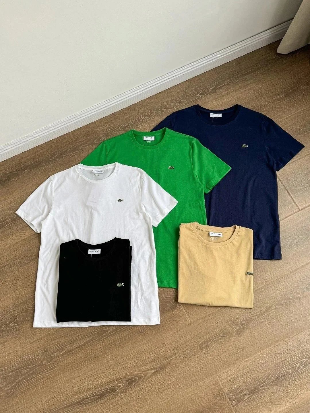 Five Lacoste T-Shirts in Various Colors