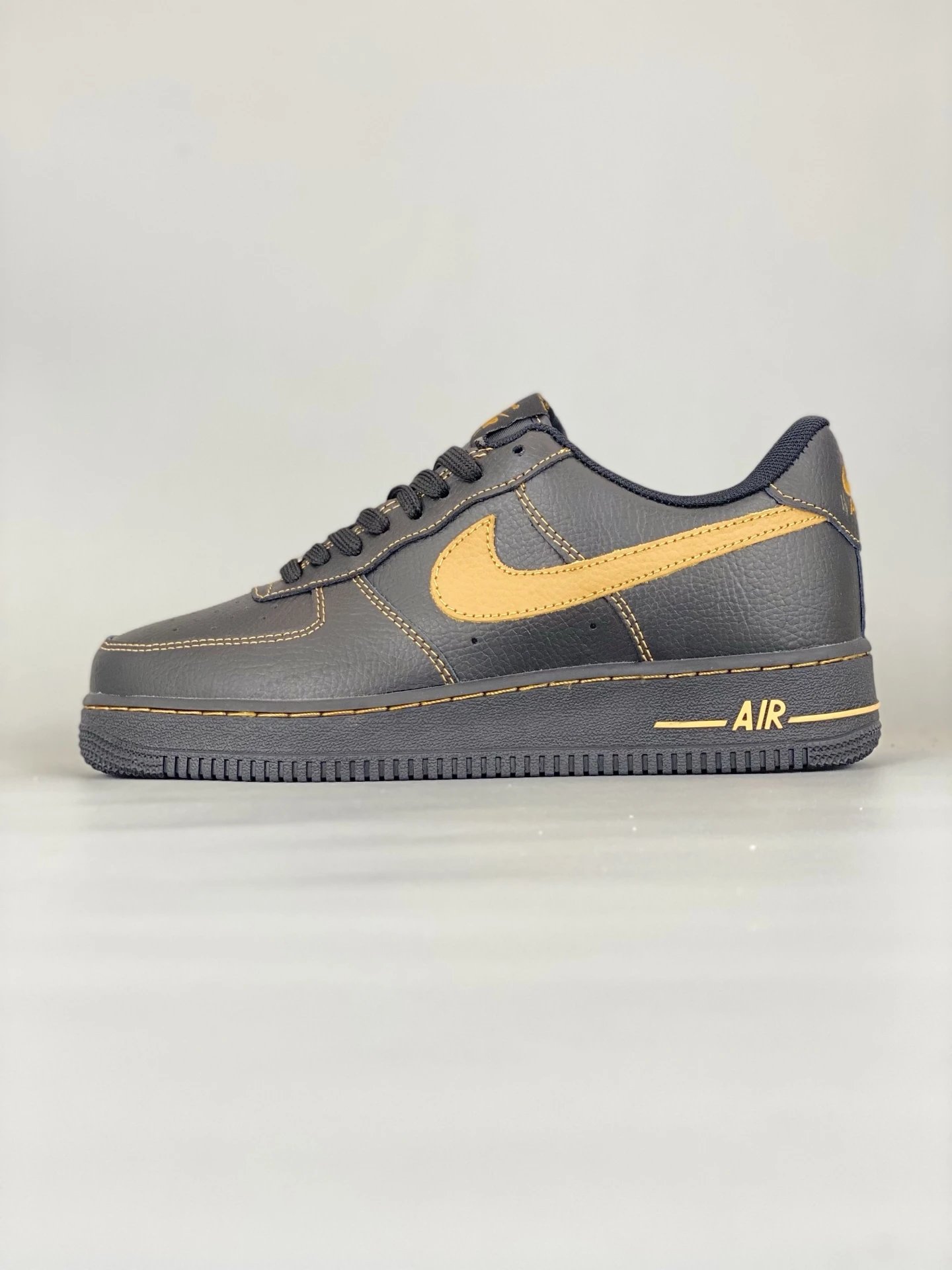 Nike Air Force 1 Black Gold Leather Low Sneakers